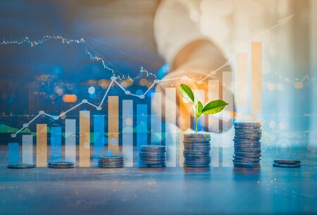 148581549-double-exposure-of-money-coin-stack-growing-graph-wit_p73764